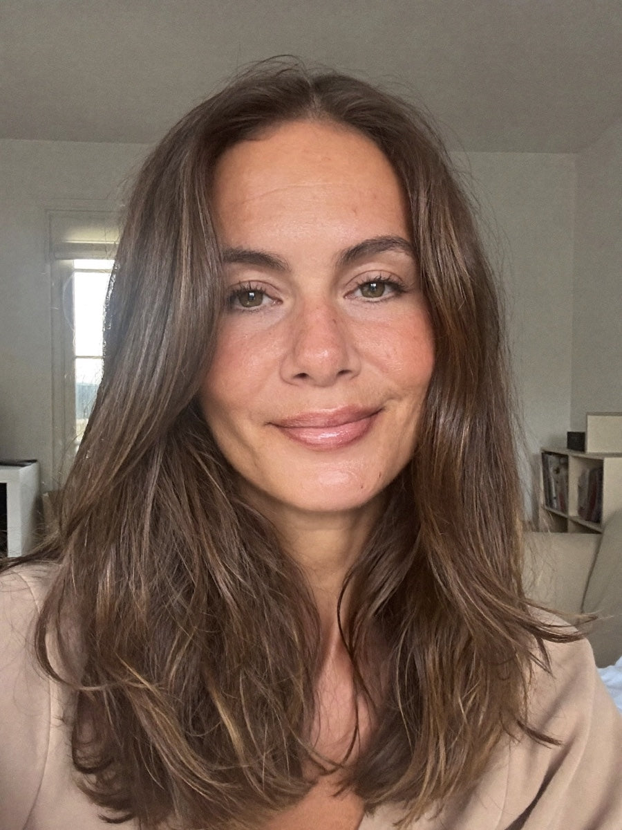 Woman with long brown hair photographed in natural light