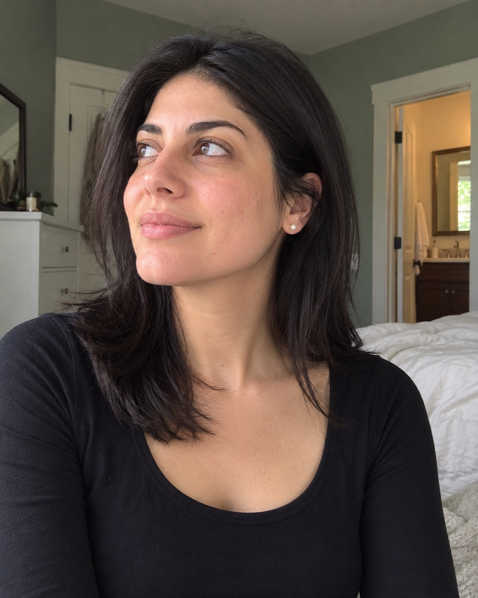 Woman with shoulder-length dark hair photographed in natural light